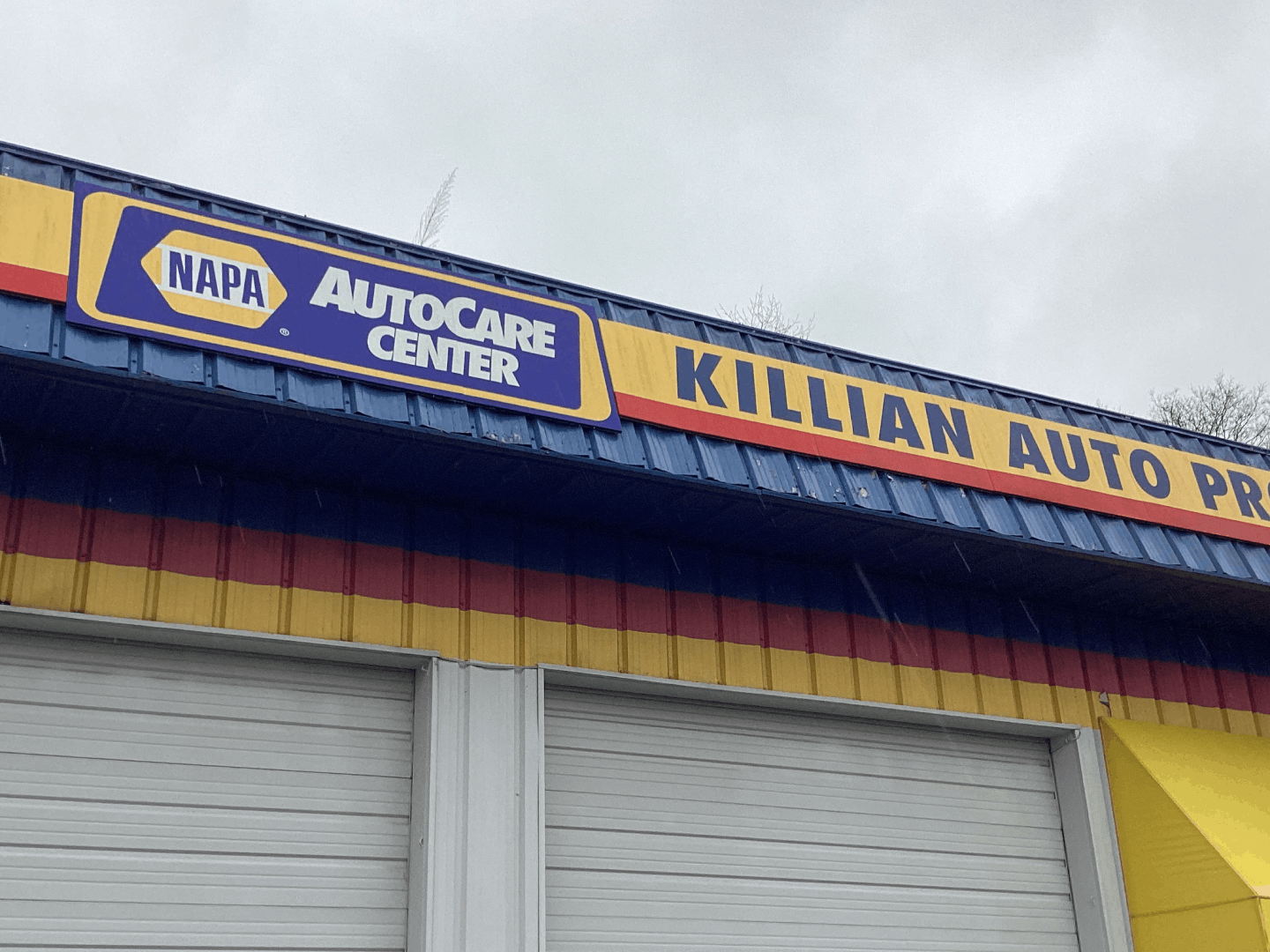 NAPA Autocare Center and Killian Auto Pro sign on a commercial building exterior.