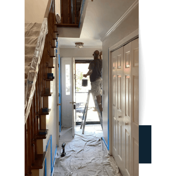 Greenville 29 Man painting hallway in Greenville County home.