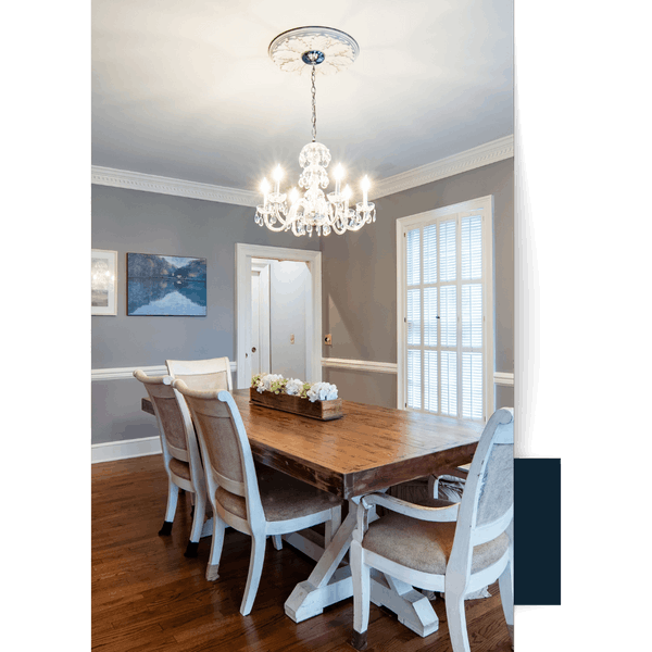 _Oconee County 29 Elegant dining room with a crystal chandelier, wooden table, and upholstered chairs.