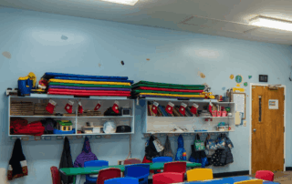 Portfolio 2911 Preschool classroom with colorful tables, chairs, and shelves