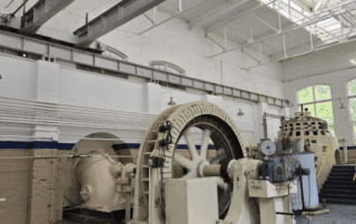 Portfolio 2912 Vintage industrial turbine in a large hall with a skylight