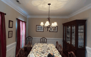 Portfolio 296 Elegant dining room with chandelier, floral tablecloth, and china cabinet