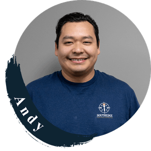 Andy, a smiling man wearing a blue t-shirt with the South Edge logo.