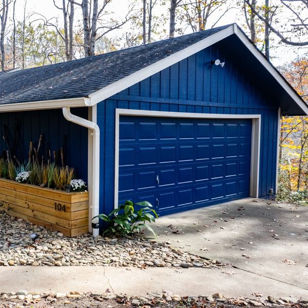 Blue Garage Door With Planter Box Boosting Curb Appeal and Property Value