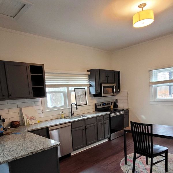 choose colors Modern kitchen with dark cabinets and granite countertops