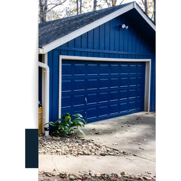 Dark Blue Garage Door With White Trim A freshly painted navy blue garage door and siding, Easley Painting