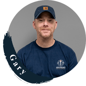 Gary from South Edge, wearing a navy blue cap and t-shirt.