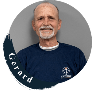 Gerard from Southedge, smiling and wearing a navy blue t-shirt.