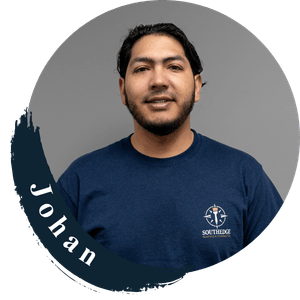 Johan from Southridge, smiling in a blue t-shirt