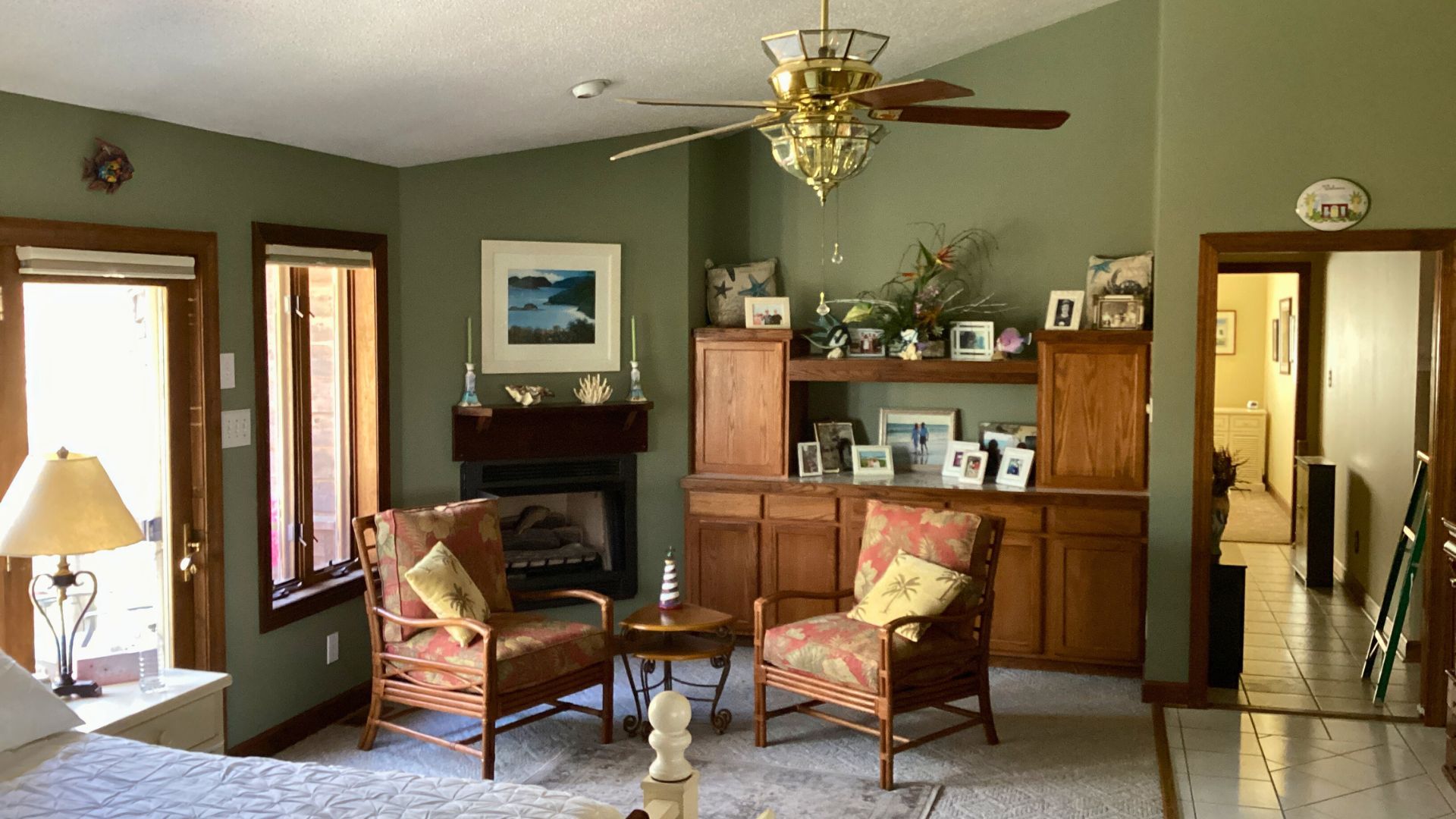 Cozy living room with fireplace and built-in cabinets, ready for interior painting.
