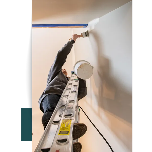 Person Painting Wall From Ladder A Process Built on Trust