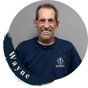 Wayne from South Edge, wearing a navy blue shirt with the South Edge logo