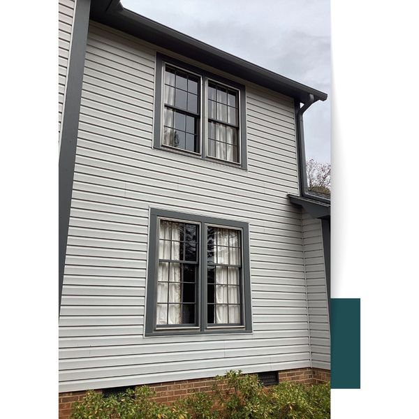 White Vinyl Siding House Windows Exterior of a house in Greer, SC, with freshly painted trim and siding.