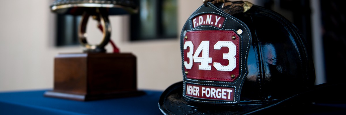 FDNY helmet with "343" and "Never Forget" honoring 9/11 firefighters